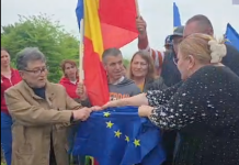 VIDEO. De Ziua Europei, Șoșoacă a rupt steagul UE la mănăstire, alături de fostul ziarist Miron Manega, actual senator SOS. Putinista e plătită cu 20.000 de euro ca europarlamentar. Partidul său a pus umărul, alături de PSD și AUR, la demiterea guvernului pro-european